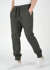 Close-up front angle of ItalyMorn men's army green jogger pants, emphasizing the smooth fabric drape, tailored side seams, and comfortable everyday fit