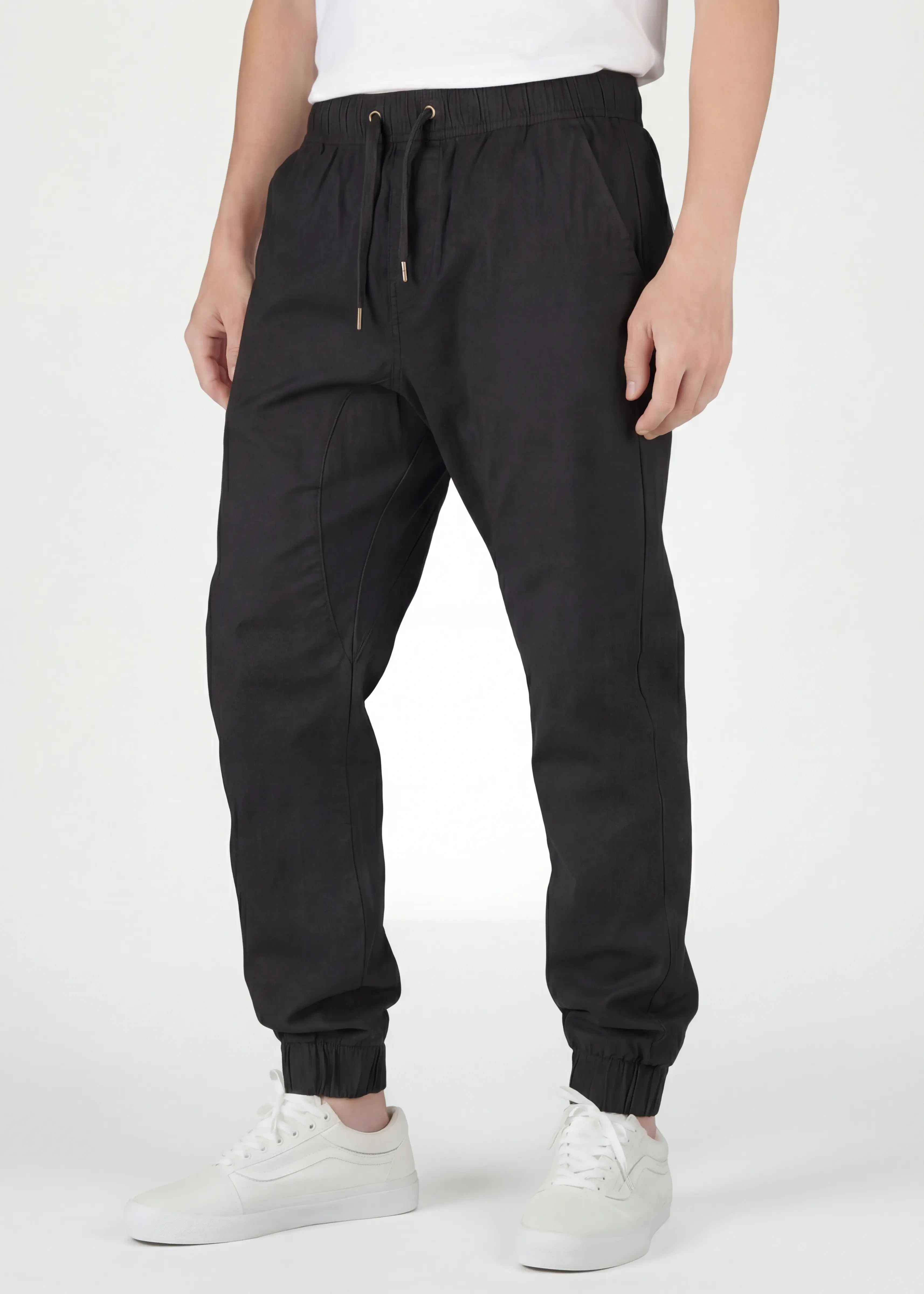  Front view close-up of ItalyMorn men's black jogger pants, featuring a comfortable elastic waistband with adjustable drawstrings, functional side pockets, and a clean slim-fit design