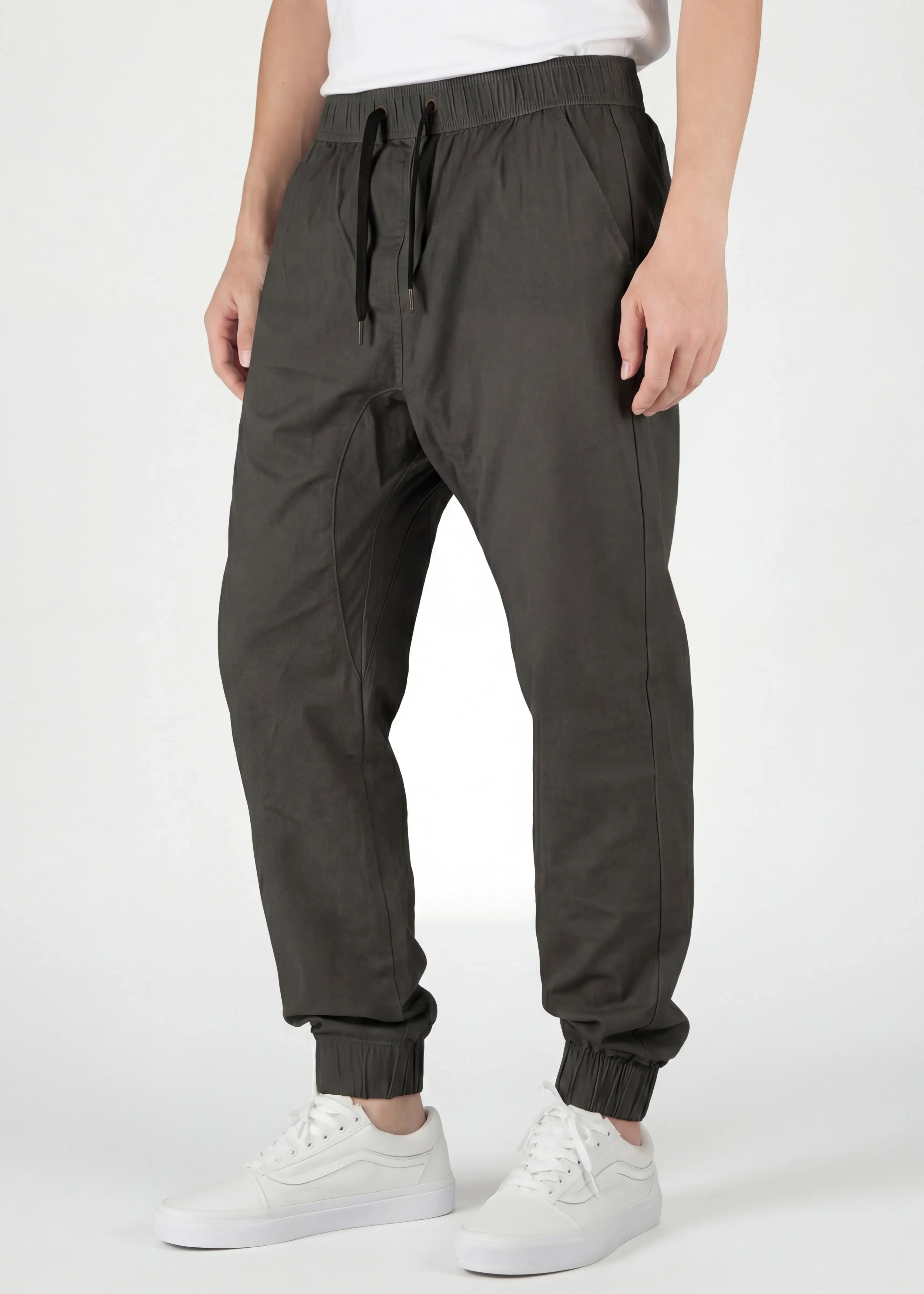  Close-up front view of ItalyMorn men's dark grey green jogger pants, featuring a comfortable elastic waistband with black drawstrings, functional side pockets, and a clean, modern slim fit