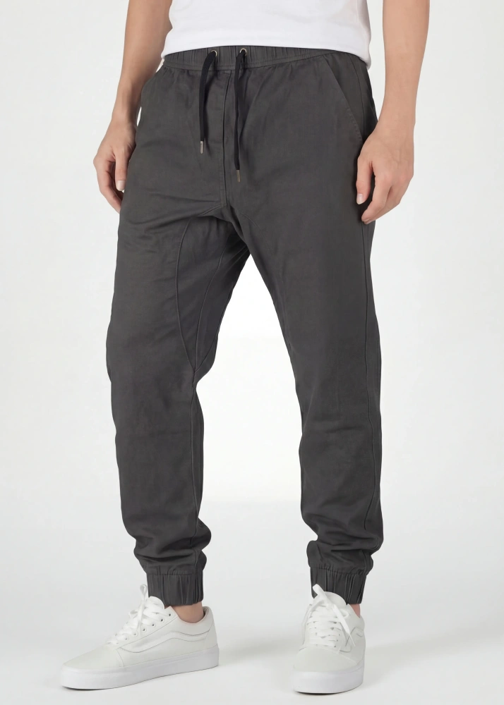  Front view detail of ItalyMorn men's dark grey jogger pants, featuring a comfortable elastic waistband with black drawstrings, deep angled side pockets, and a clean, slim-tapered fit