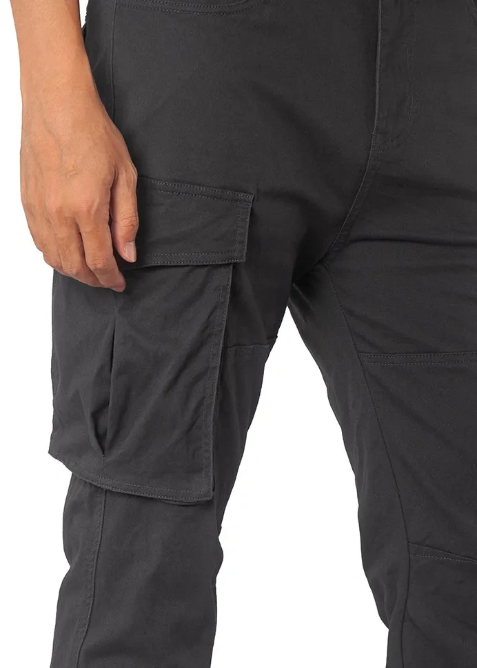 Close-up detail of ItalyMorn men's dark grey cargo pants, highlighting the durable fabric texture, reinforced stitching, and the secure flap closure of the spacious side cargo pocket.

