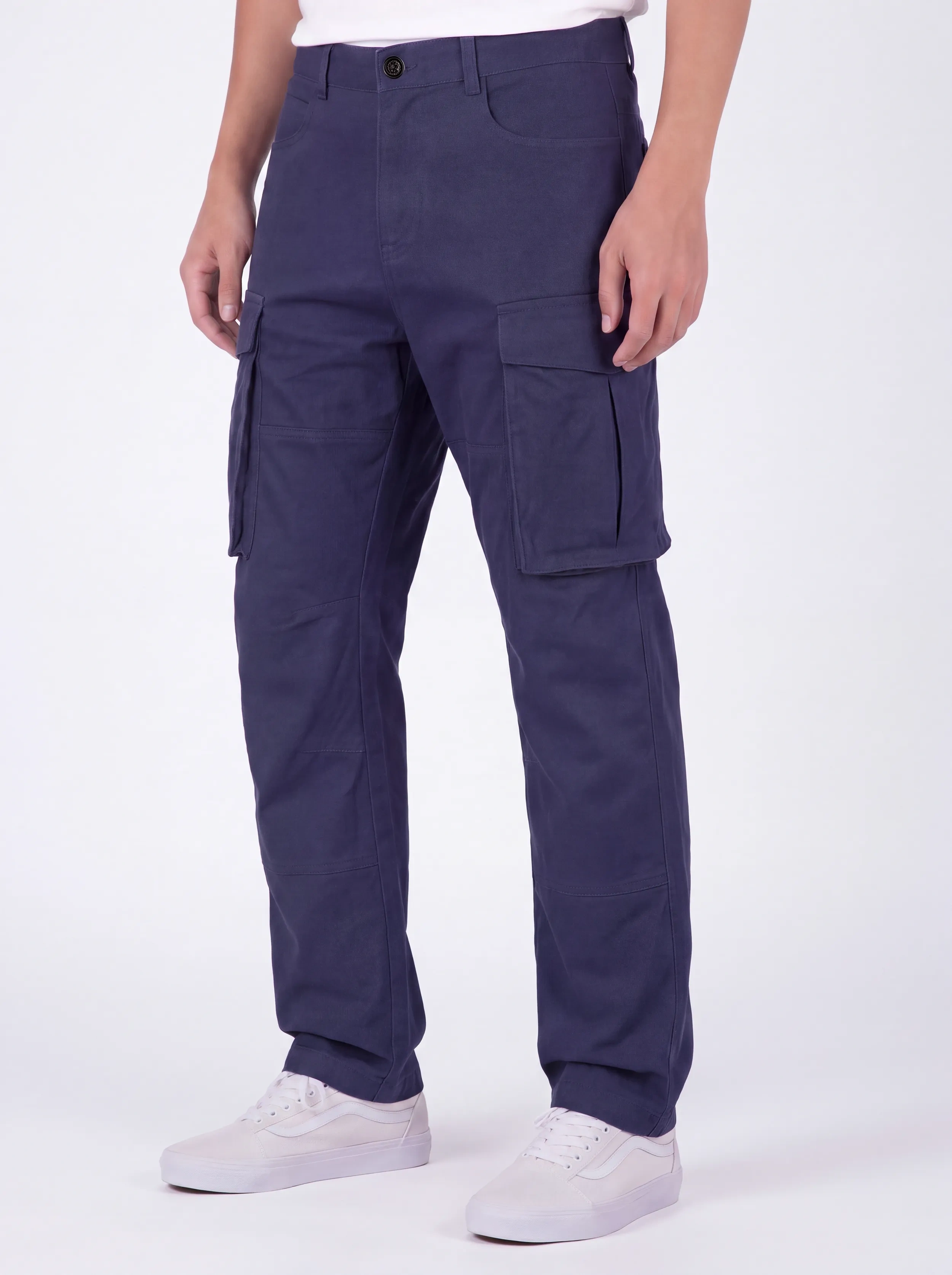  Front view of a male model wearing ITALYMORN men's navy blue cargo pants, featuring a classic button closure, deep front pockets, and functional side cargo pockets, paired with white sneakers.
