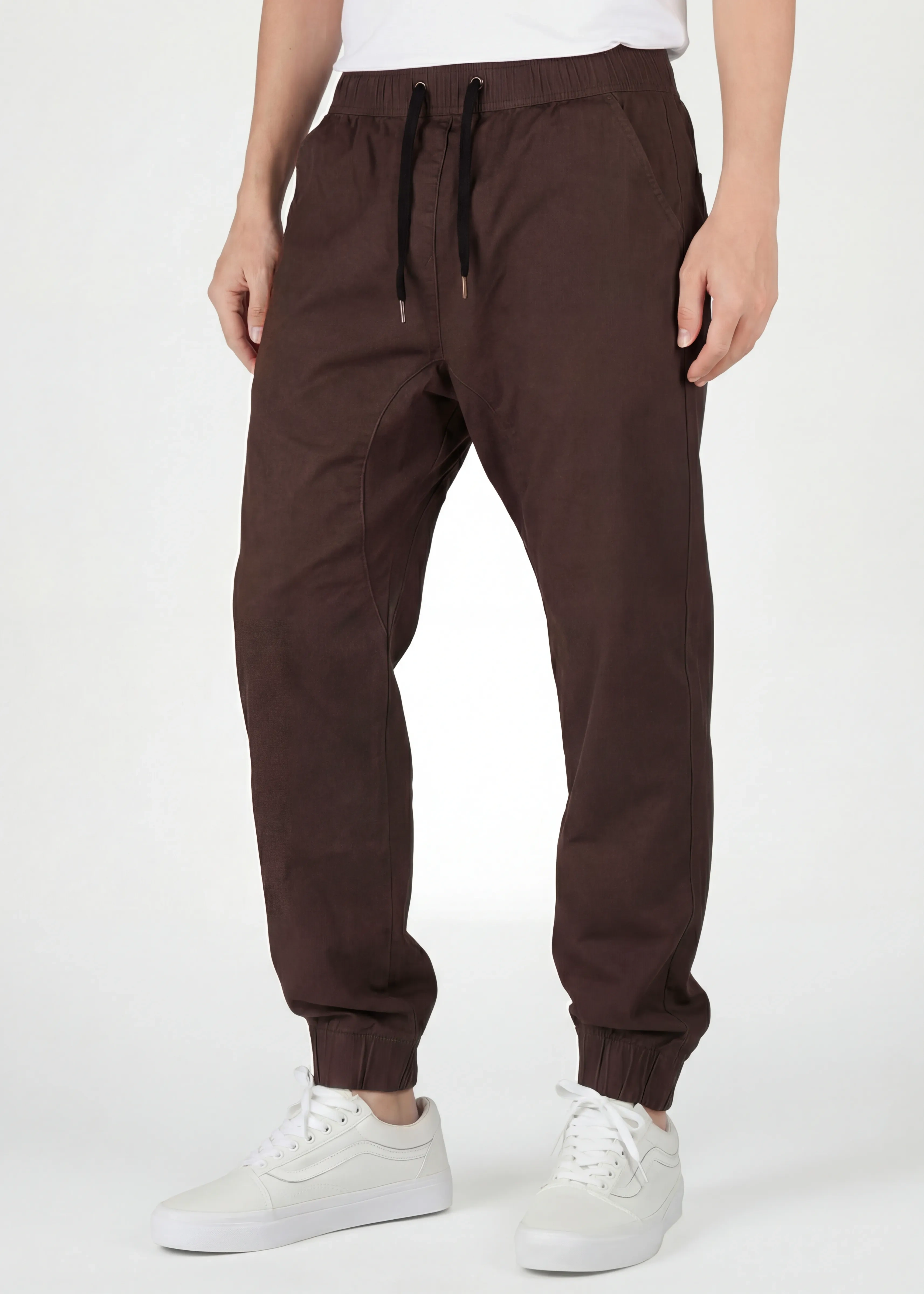 Front close-up of ItalyMorn men's coffee brown jogger pants, featuring an adjustable elastic waistband with black drawstrings, deep functional side pockets, and a clean tailored look.