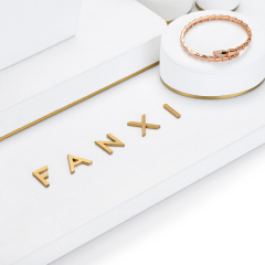 FANXI TT033 elegant white microfiber jewelry display set with golden metal frame base