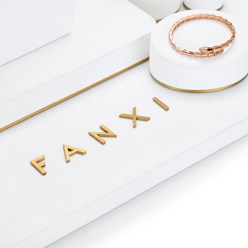 FANXI TT033 elegant white microfiber jewelry display set with golden metal frame base