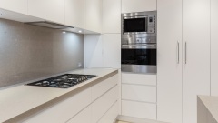 Unionlands Cabinetry Modern Style Kitchen Cabinet with Island Quartz Waterfall