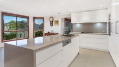 Unionlands Cabinetry Modern Style Kitchen Cabinet with Island Quartz Waterfall