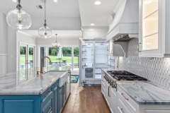 Unionlands Cabinetry Two Tone Raised Panel Painted Kitchen Cabinet With Blue Glass Fronted Wall Cabinet