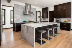Uniolands Cabinetry Modern Kitchen Cabinet Timber Veneer Finish Slab Panel With Large Marble Waterfall Island