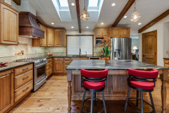 Unionlands Cabinetry Raised Panel Stain Hickory Solid Wood With Sintered Stone Countertop Island and Glass Wink Rack