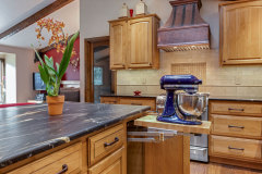 Unionlands Cabinetry Raised Panel Stain Hickory Solid Wood With Sintered Stone Countertop Island and Glass Wink Rack