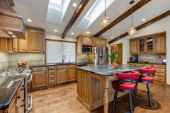 Unionlands Cabinetry Raised Panel Stain Hickory Solid Wood With Sintered Stone Countertop Island and Glass Wink Rack