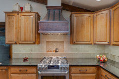 Unionlands Cabinetry Raised Panel Stain Hickory Solid Wood With Sintered Stone Countertop Island and Glass Wink Rack