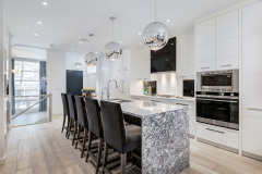 Unionlands Cabinetry White Matte Lacquer Painted With Black Quartz Countertop Waterfall