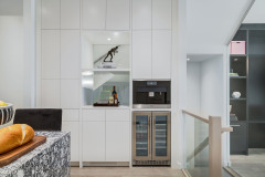 Unionlands Cabinetry White Matte Lacquer Painted With Black Quartz Countertop Waterfall