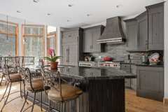 Unionlands Cabinetry Vintage Style Solid Wood Shaker Door Stain Kitchen Cabinet With Black Painted Shiplap Panel Granite Countertop Island Cabinets