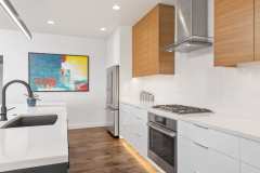Unionlands Cabinetry Modern Kitchen Cabinet High Gloss Lacquer Slab Panel and Bright Melamine Finish Top Cabinet With Navy Blue Island