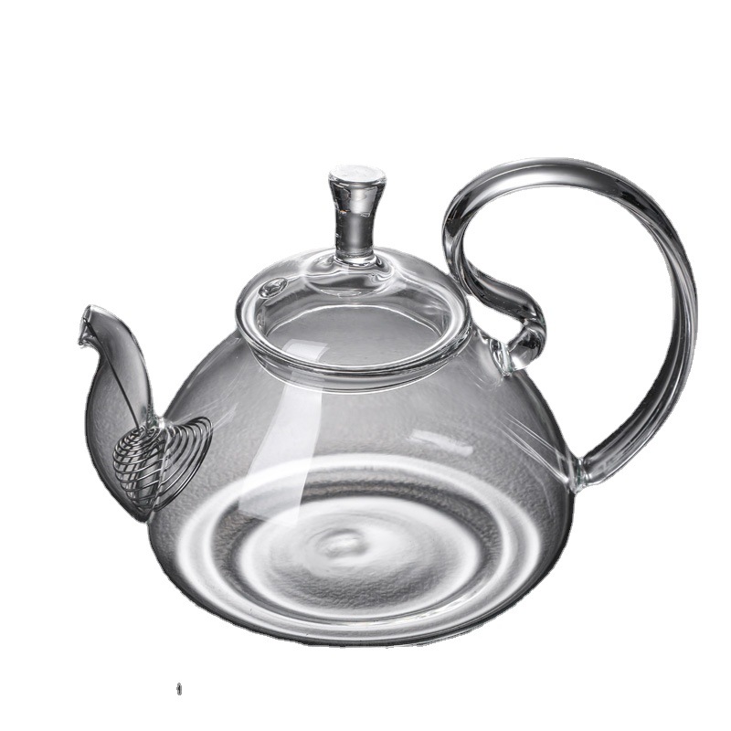 Squirrel glass teapot on stove