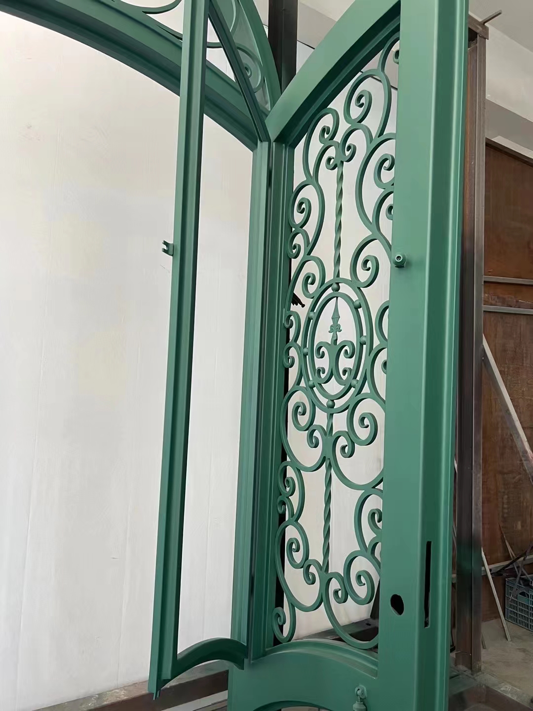double wrought iron front door in green color