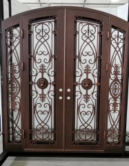 Double panel wrought iron front entry door with arc top in brown color
