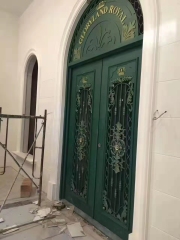double wrought iron front door in green color