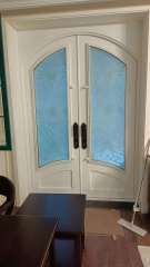 double wrought iron front door in white color