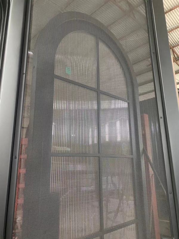 Single Arc top wrought iron door with glass