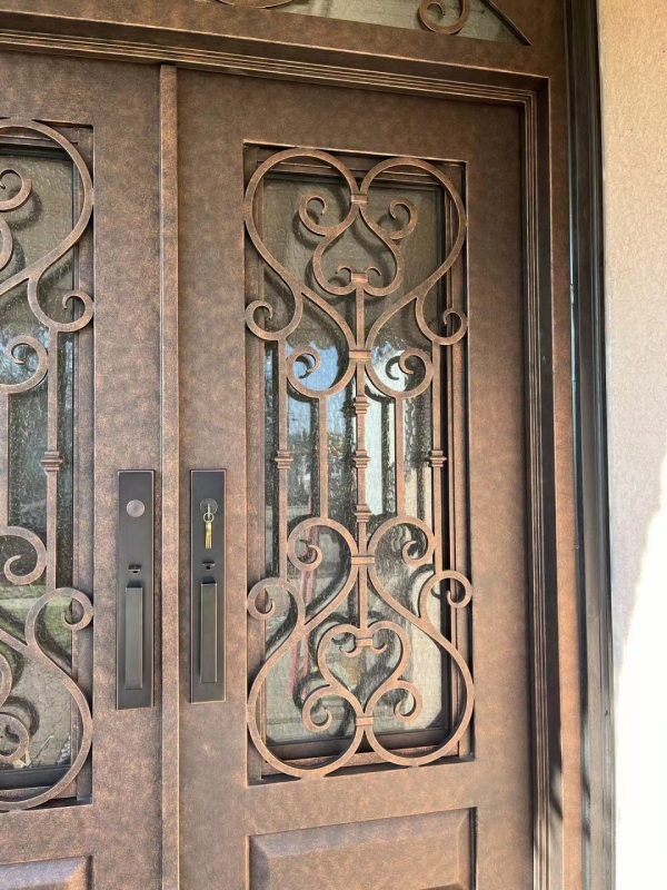 double wrought iron front door in brown color