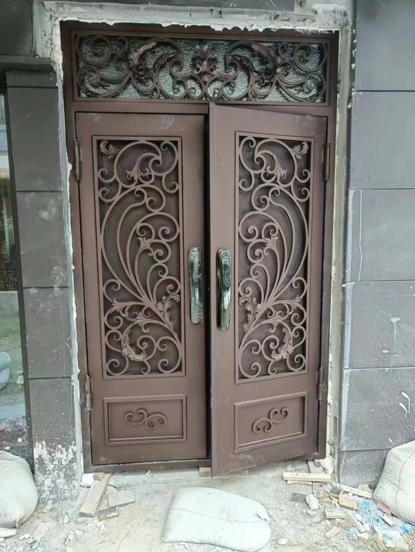 double wrought iron front door in brown color