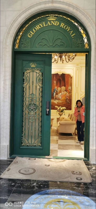 double wrought iron front door in green color