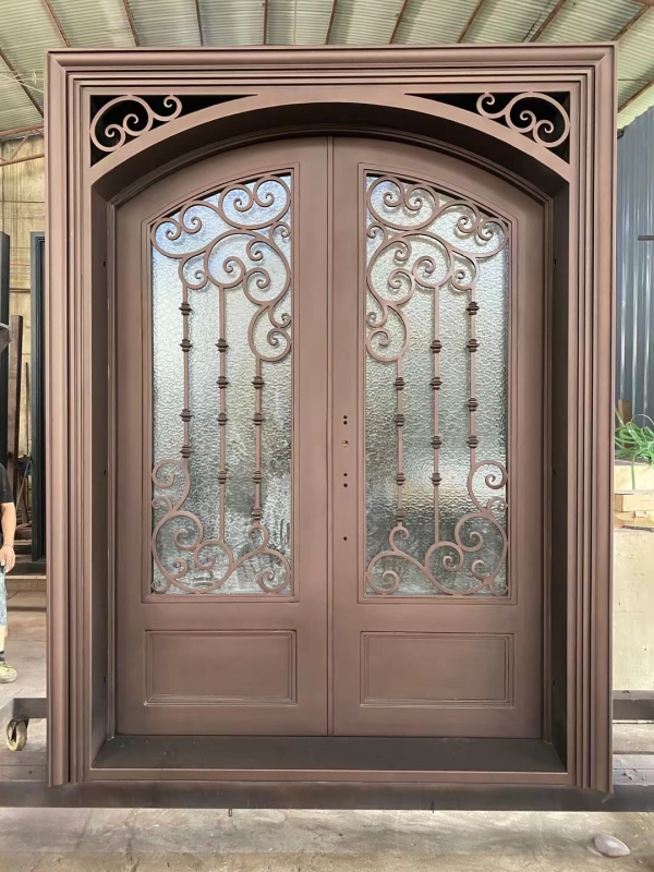 Double panel wrought iron front entry door with arc top in brown color