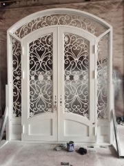 double wrought iron front door in white color