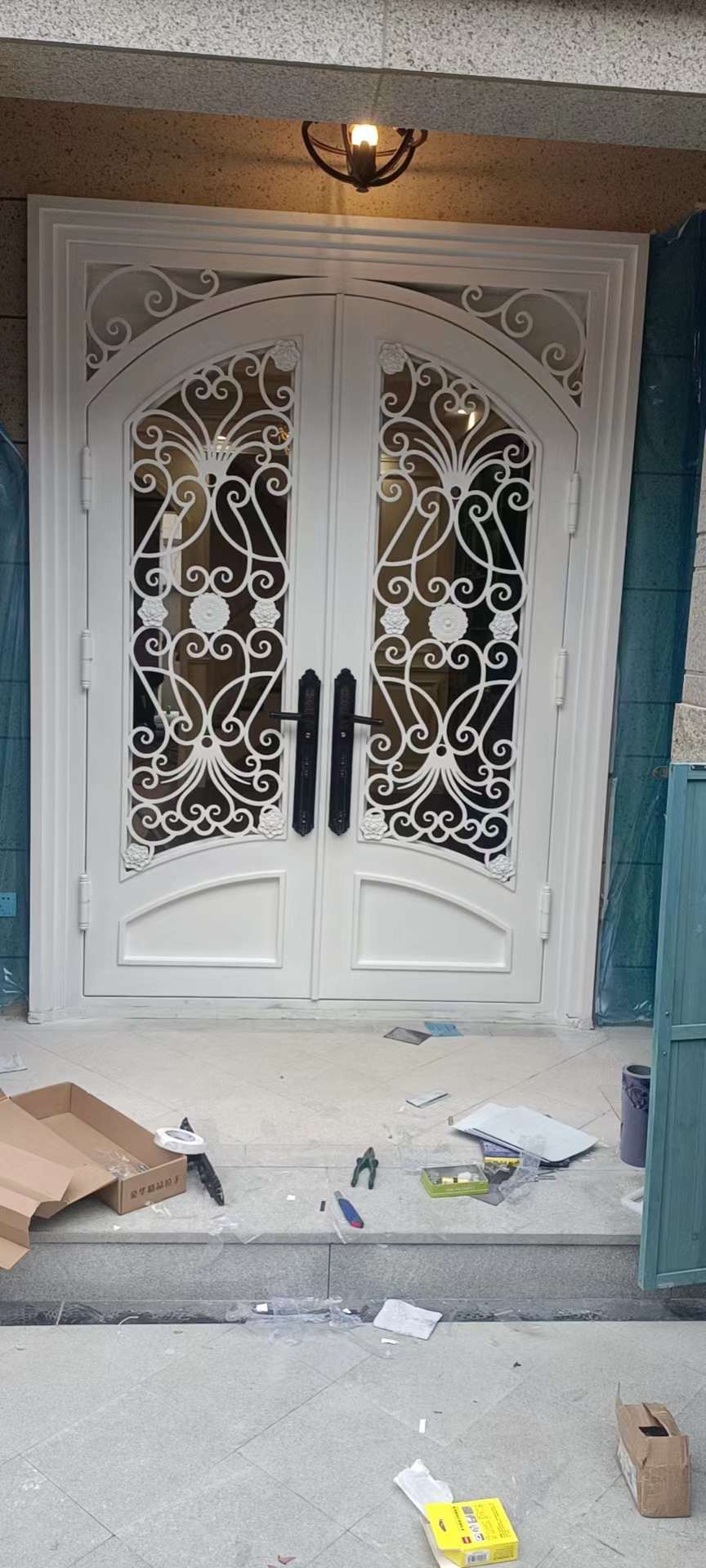 double wrought iron front door in white color