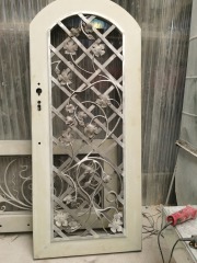 white wrought iron front door