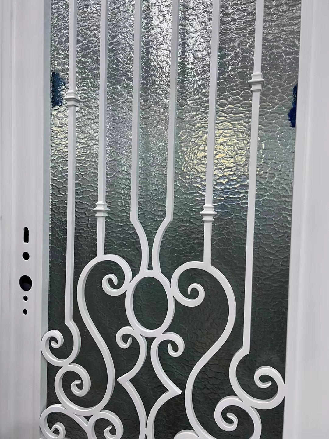 white wrought iron front door