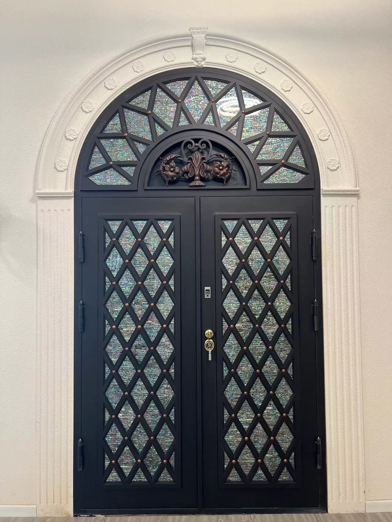 Double iron front door with Arc top