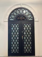 Double iron front door with Arc top