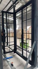 Double iron front glass door with transom