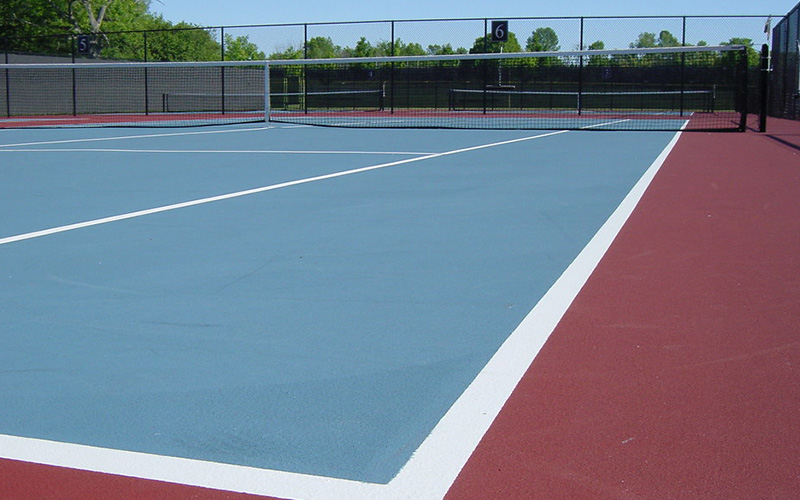 What are the advantages of acrylic tennis court flooring?