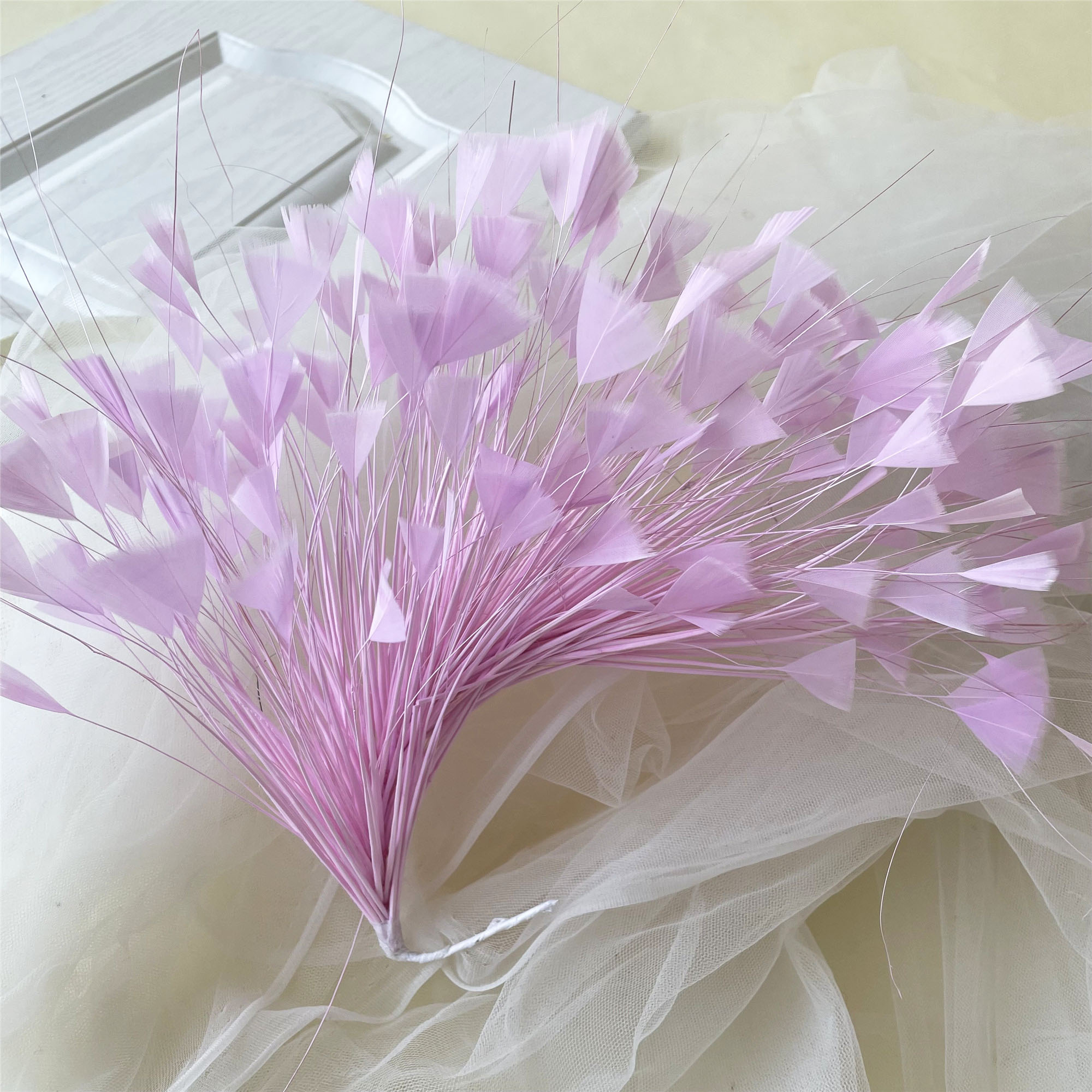 The Soul of the Silhouette: Why Feathers Define Couture Millinery