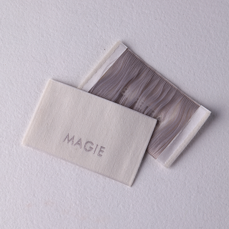 Custom woven labels with personalized logos for clothing brands