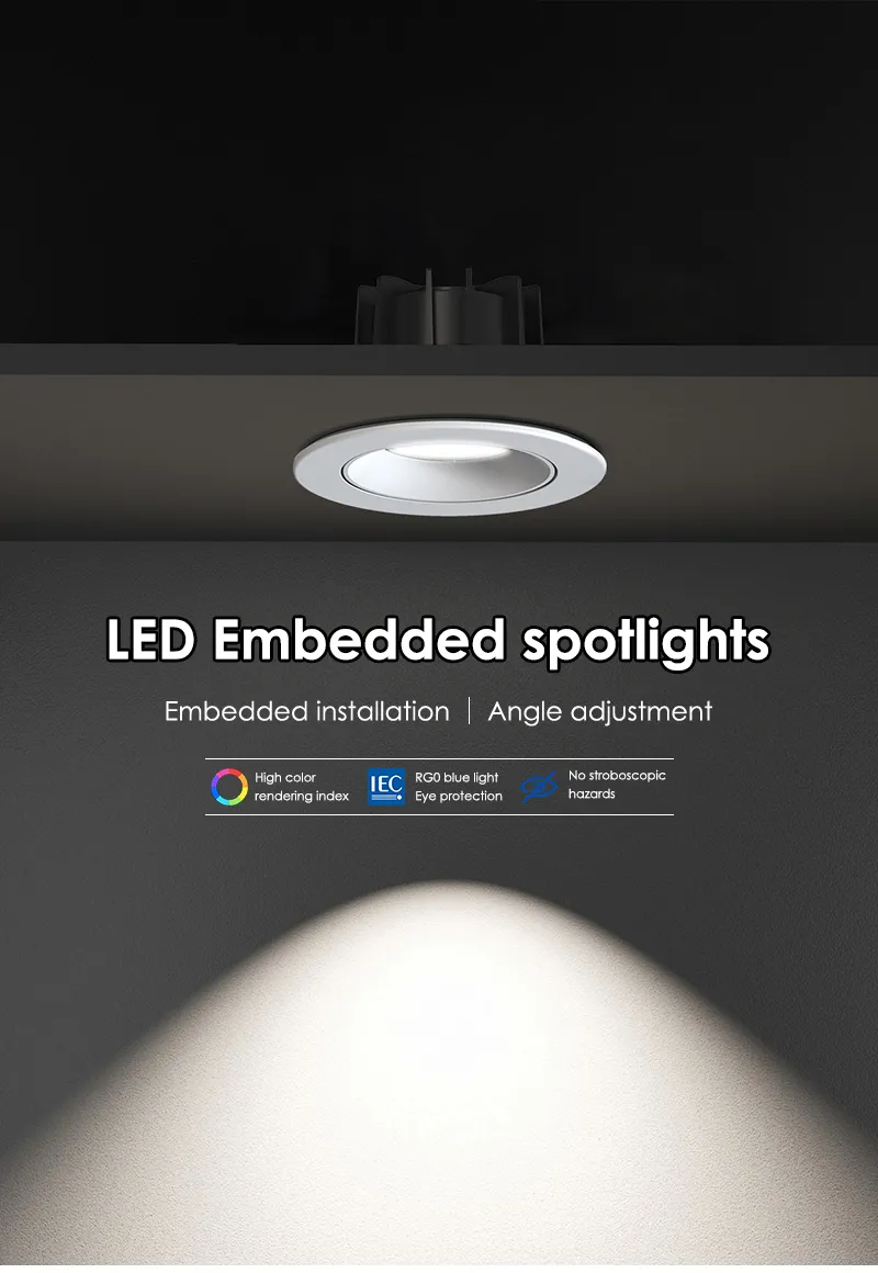 Round white recessed spotlight installed in a ceiling