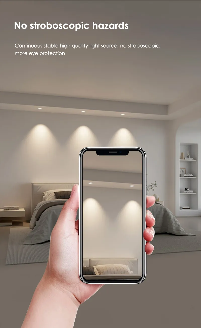 Hand holding a phone showing flicker-free downlight beams