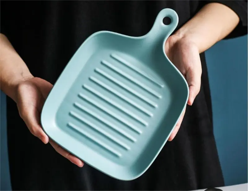 Colorful solid ceramic plates with handles, matte glaze food serving plates with frying pans that look to handle baking pans