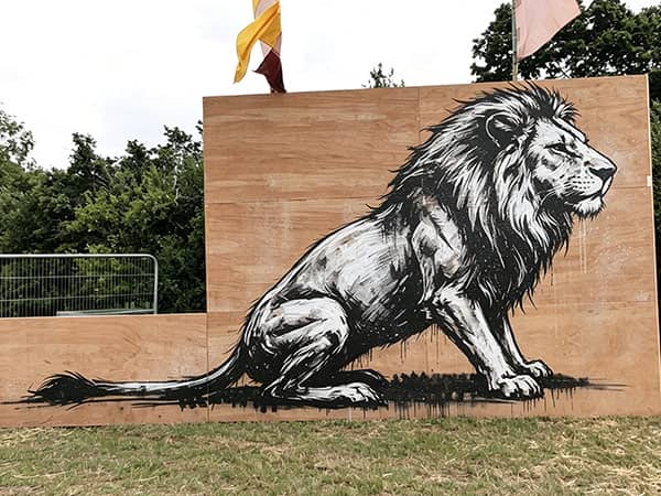 Outdoor black ink lion factory wall graffiti
