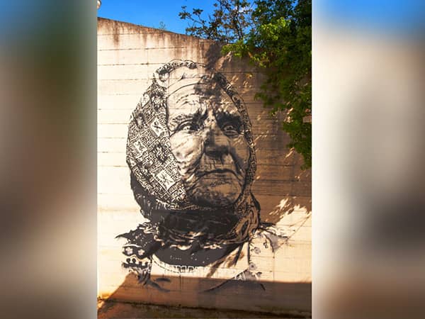 TXC-WP2500 wall printer sample, monochrome realistic old lady portrait graffiti printed on outdoor concrete wall