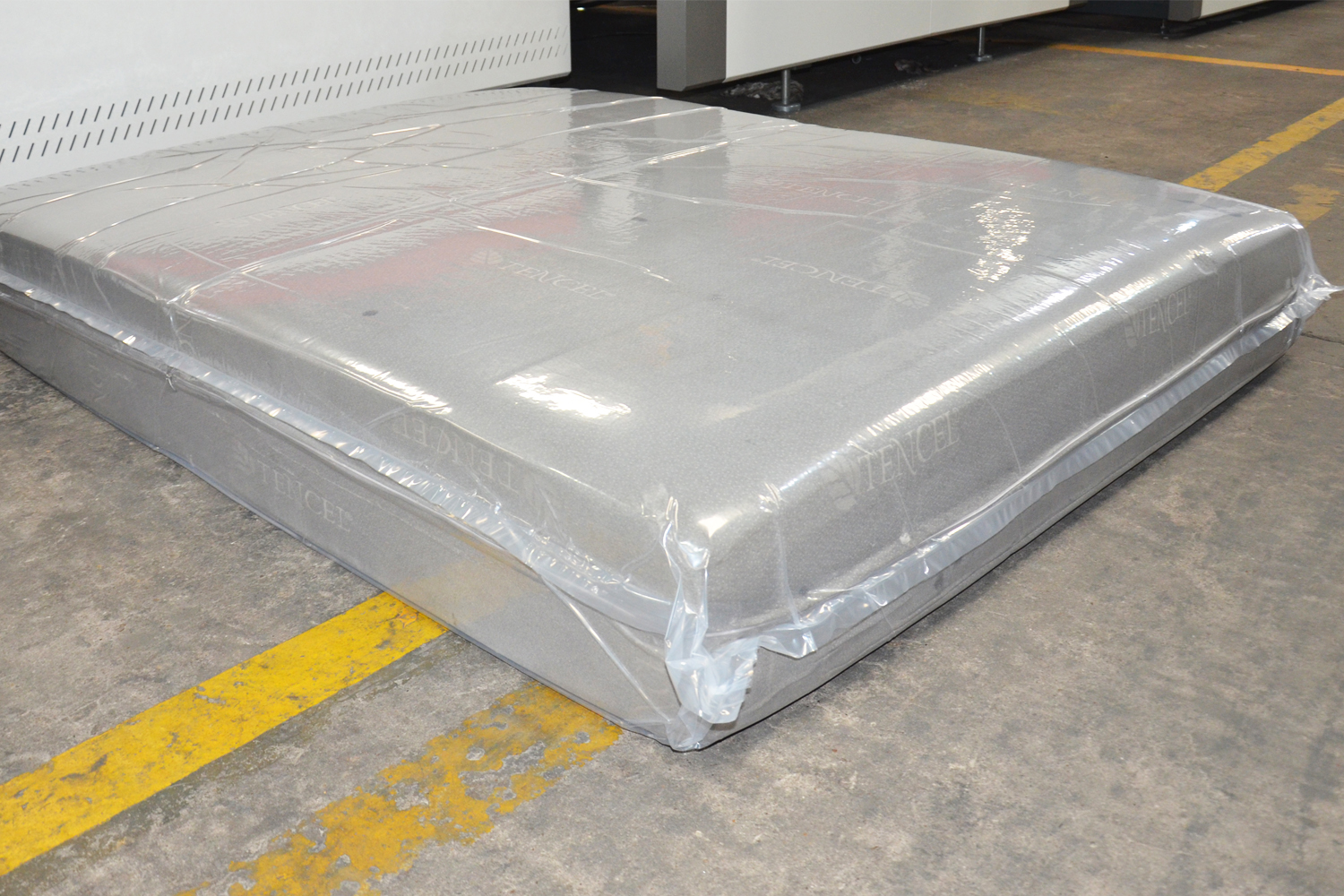 How to efficiently roll pack a mattress