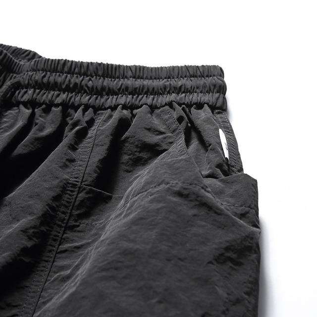 Hot sale summer quick dry big pocket quarter pants trend casual solid color loose beach shorts men,Shuliqi Apparel - Men's Clothing Wholesale Manufacturer,Hot sale summer quick dry big pocket quarter pants trend casual solid color loose beach shorts men | Wholesale Men's Apparel | OEM | Shuliqi