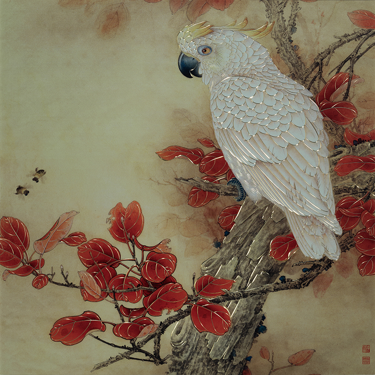 VIBRANT PARROT IN RED LEAVES
