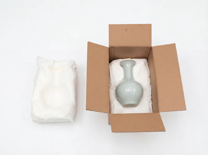 Foam-in-place packaging for fragile goods